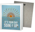 Load image into Gallery viewer, Light blue reusable swedish sponge cloth with sunburst design and soak it up text blank inside for cleaning fun