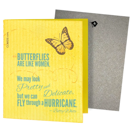 Yellow sponge cloth with butterfly print and teal betty white quote featuring two reusable swedish sponge cloths