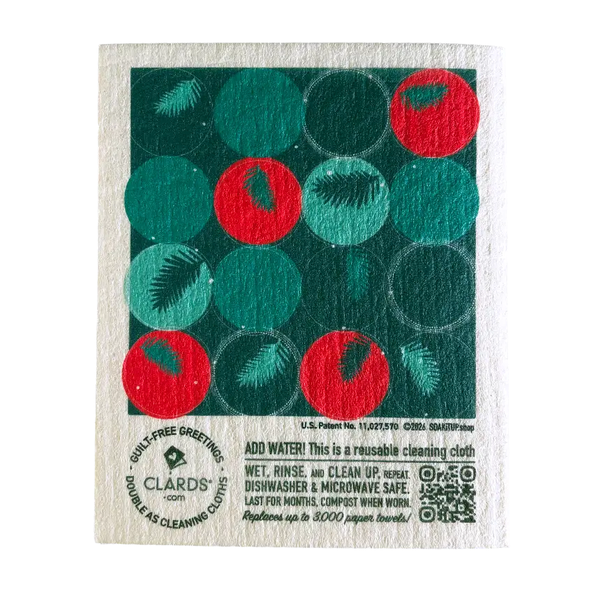 A festive green and red reusable swedish sponge cloth with a white textured fabric base from cardinal branches greeting card turns cleaning cloths