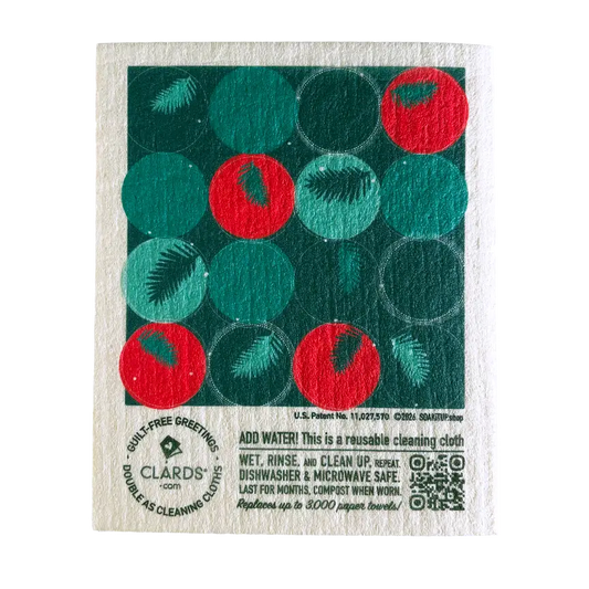 A festive green and red reusable swedish sponge cloth with a white textured fabric base from cardinal branches greeting card turns cleaning cloths