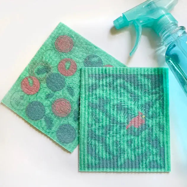 Green textured reusable swedish sponge cloths with pink and gray circular bird patterns from soak it up clards