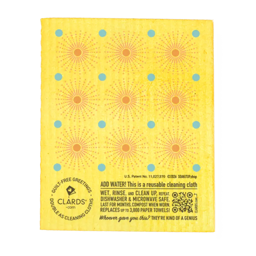 Yellow reusable swedish sponge cloth with orange sunburst and blue dots by clards as a guilt-free greeting card