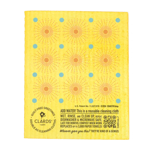 Yellow reusable swedish sponge cloth with orange sunburst and blue dots by clards as a guilt-free greeting card