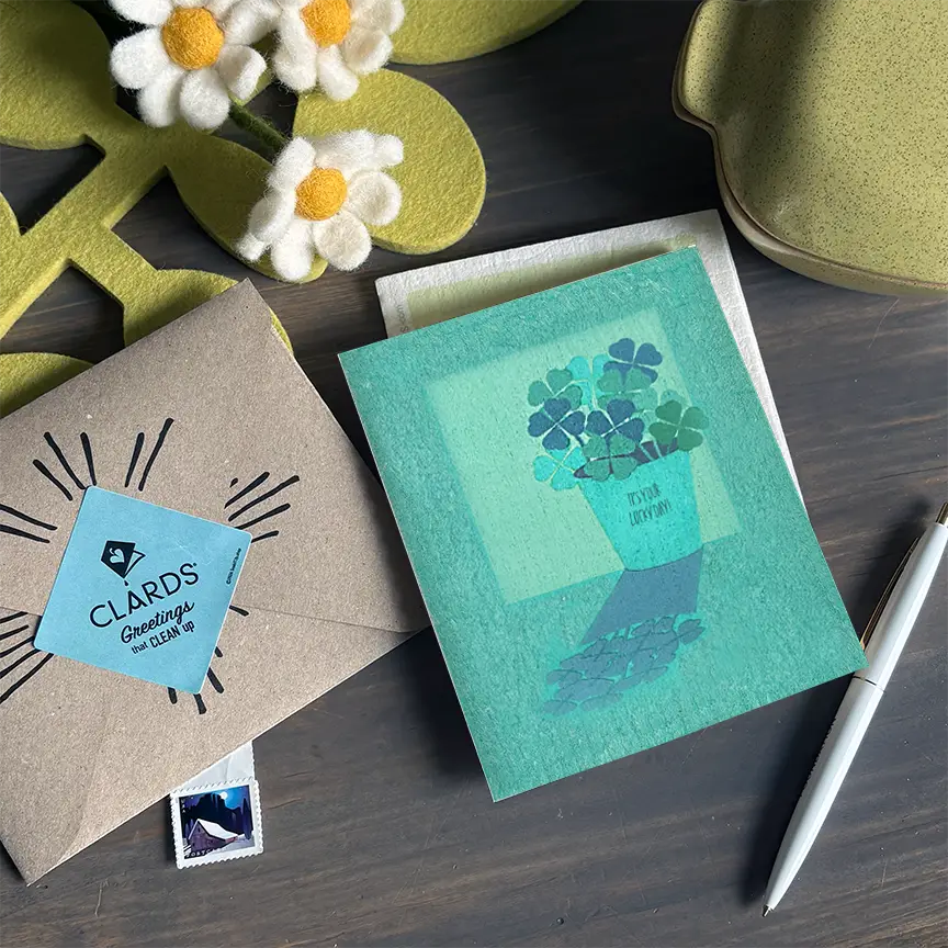 Teal fungi frog eco greeting card that turns into swedish sponge cloths and is microwave safe for cleaning