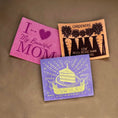 Load image into Gallery viewer, Three colorful textured reusable swedish dishcloths with printed designs in pink orange and purple best selling swedish dishcloths
